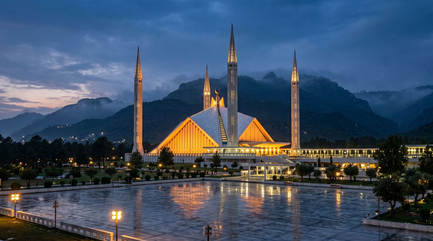 Faisal Mosque in Islamabad at dusk against the Margalla Hills